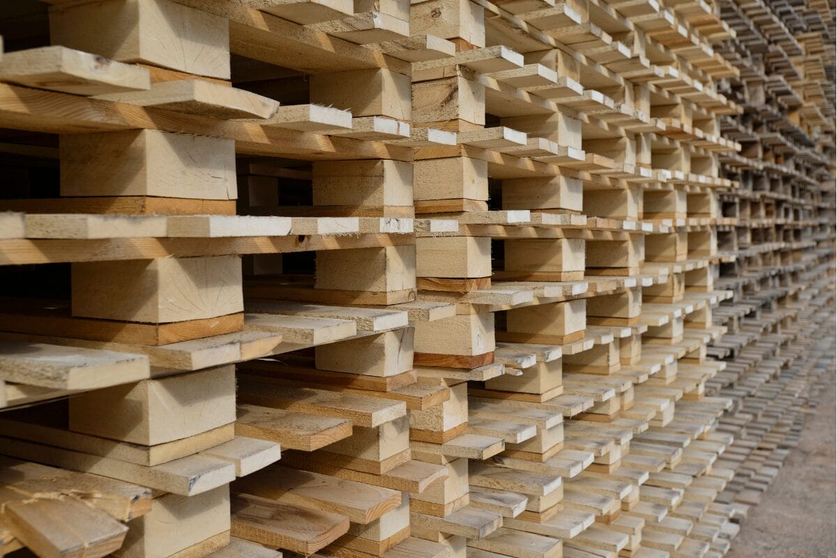 Close-up view of stacked wooden pallets showing timber blocks and layered pallet structure